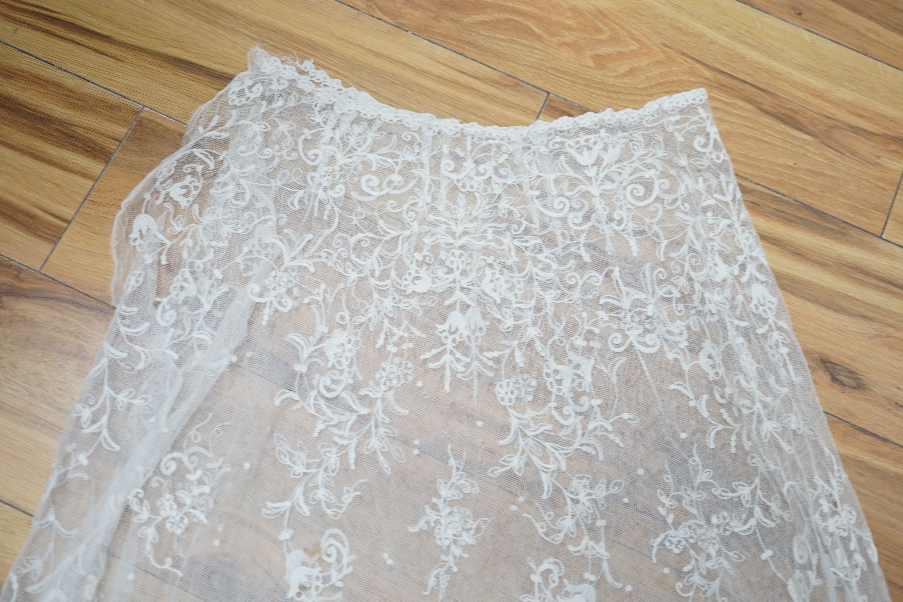 A needle lace skirt panel, a similar stole, various machine laces and trimmings